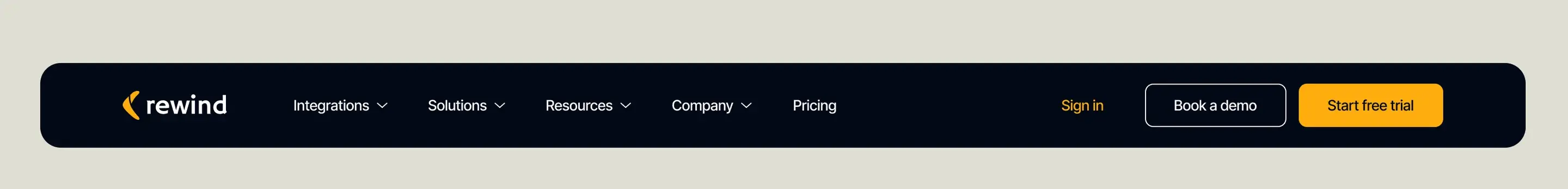 The top of the redesigned Rewind homepage: a dark navigation bar carrying the logo, menus for integrations, solutions, resources, company and pricing, and buttons to book a demo or start a free trial.