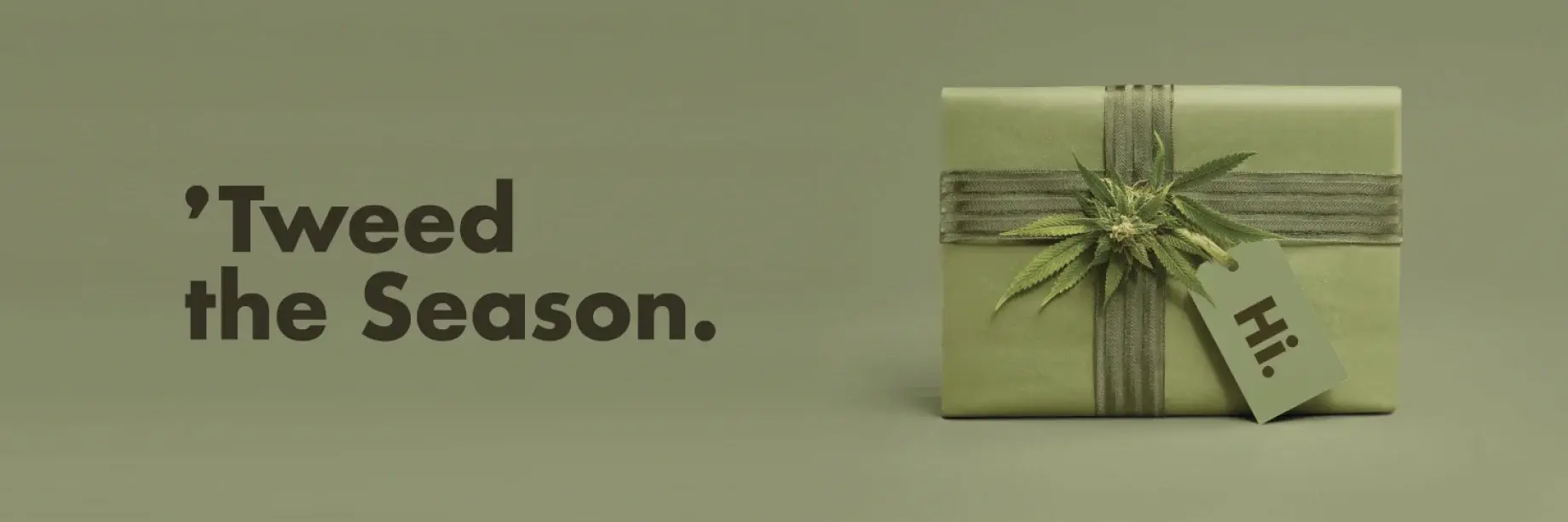 The campaign banner: “’Tweed the Season.” set beside the bud-topped gift on a sage ground.